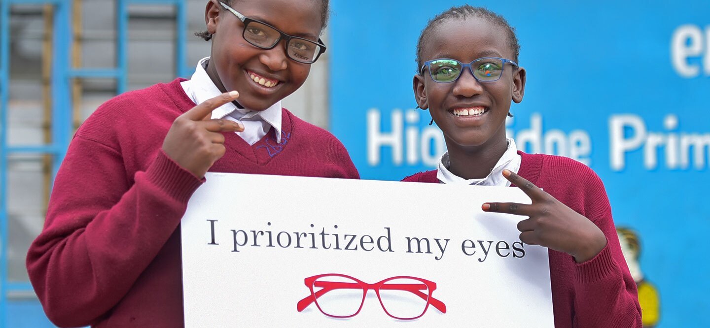 Two children with banner "I prioritized my eyes"